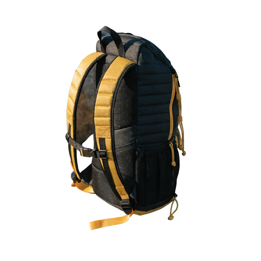 Black and yellow hiking backpack isolated on a black background with adjustable straps visible